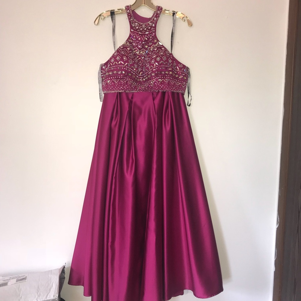 Two piece fuchsia prom gown with zippers and clips